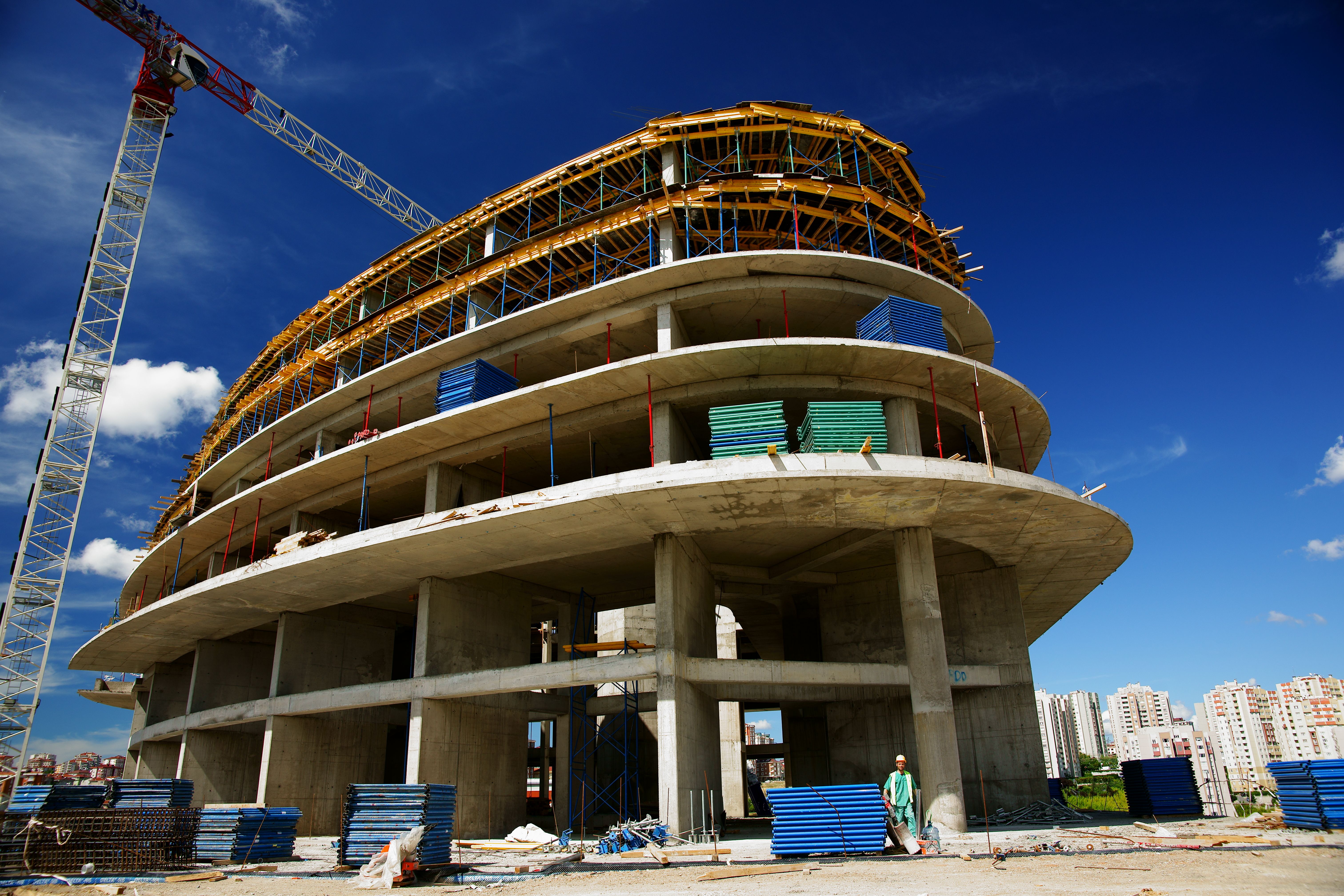A multi-storey building under construction with a crane